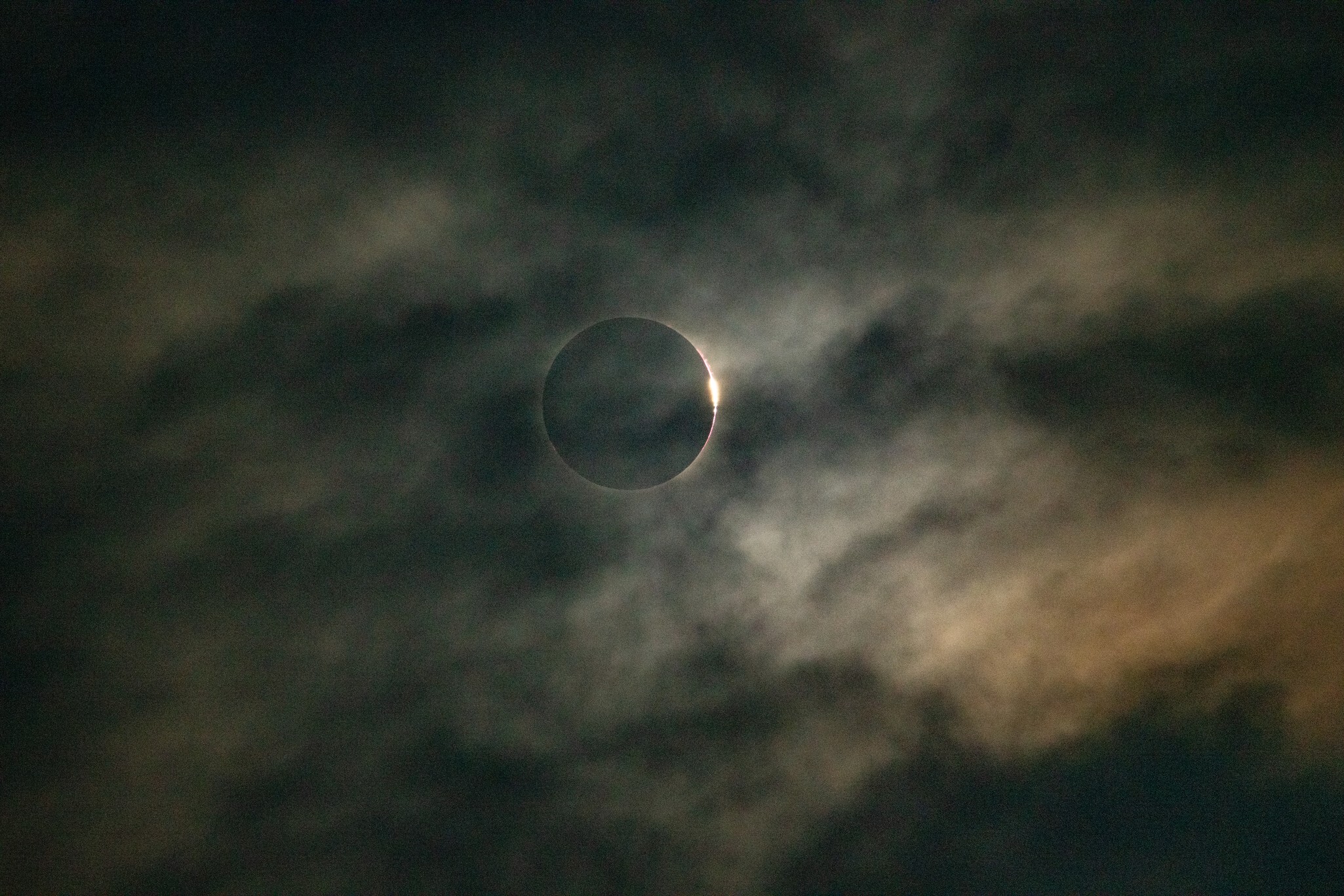 The diamond ring at the edge of totality, seen through cloud