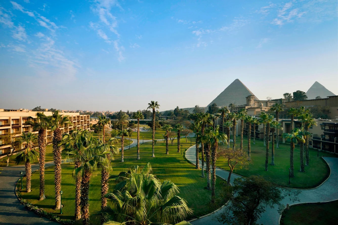 Marriott Mena House gardens with the Pyramids of Giza behind